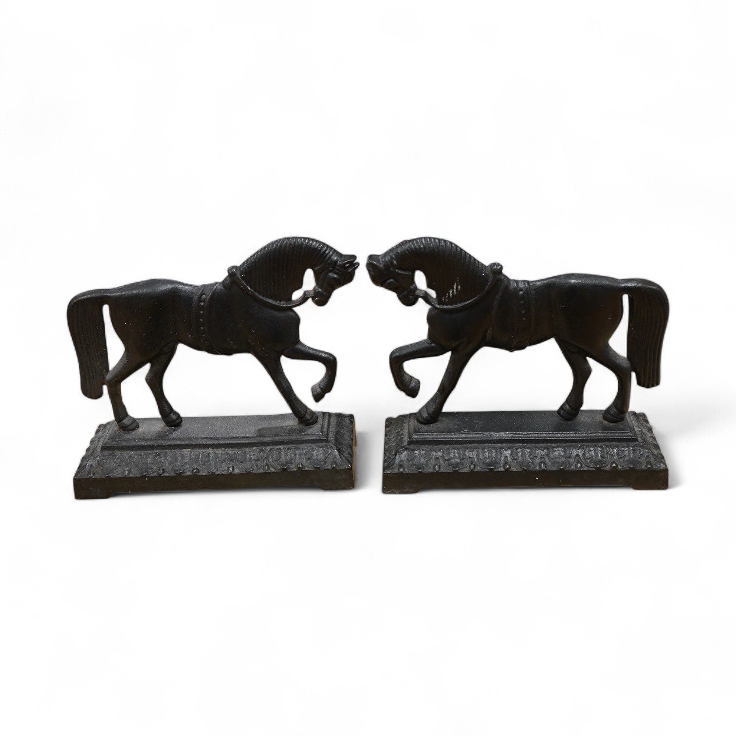 A pair of Victorian cast iron horse door stops, 24cm wide